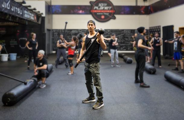 Person training with a punching bag in a gym setting